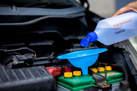 how to fill a car battery with distilled water